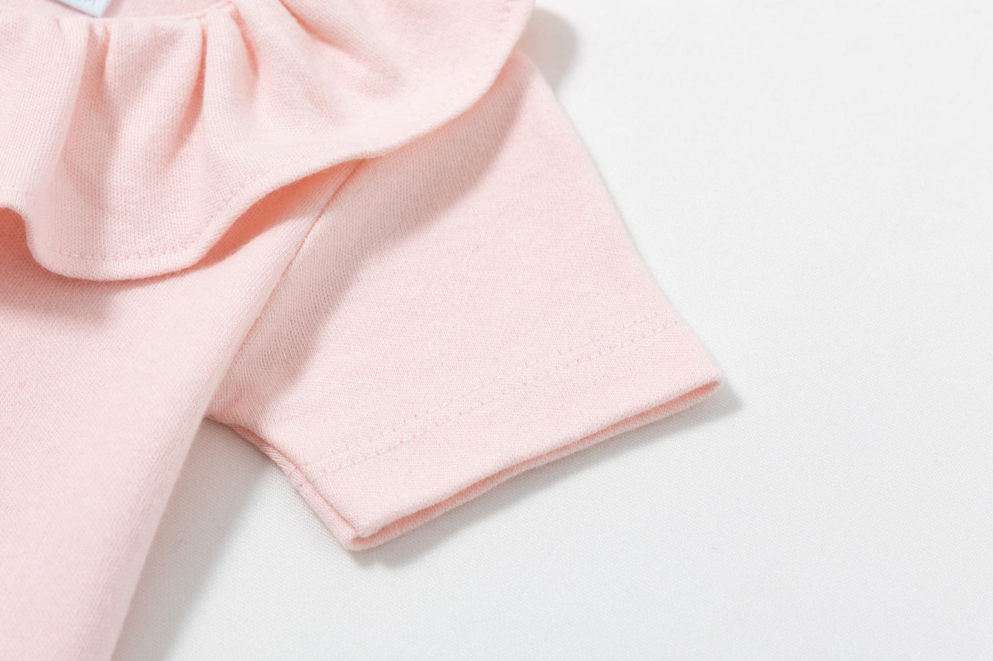 Body  cuello volante rosa bebe 1-24 meses