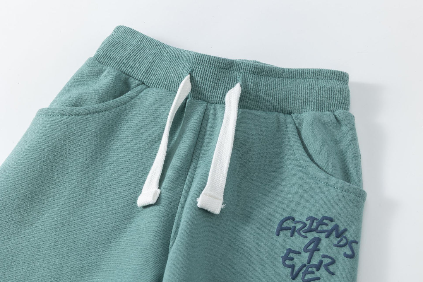 Pantalón deportivo niño felpa azul turquesa con bolsillos | 2-6 años