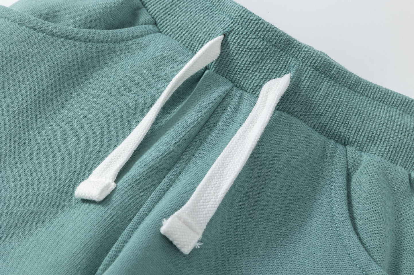 Pantalón deportivo niño felpa azul turquesa con bolsillos | 2-6 años