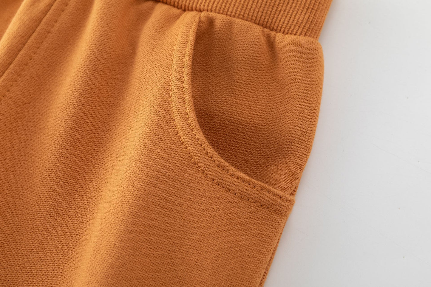 Pantalón niño felpa perchada naranja con bolsillos | 2-6 años