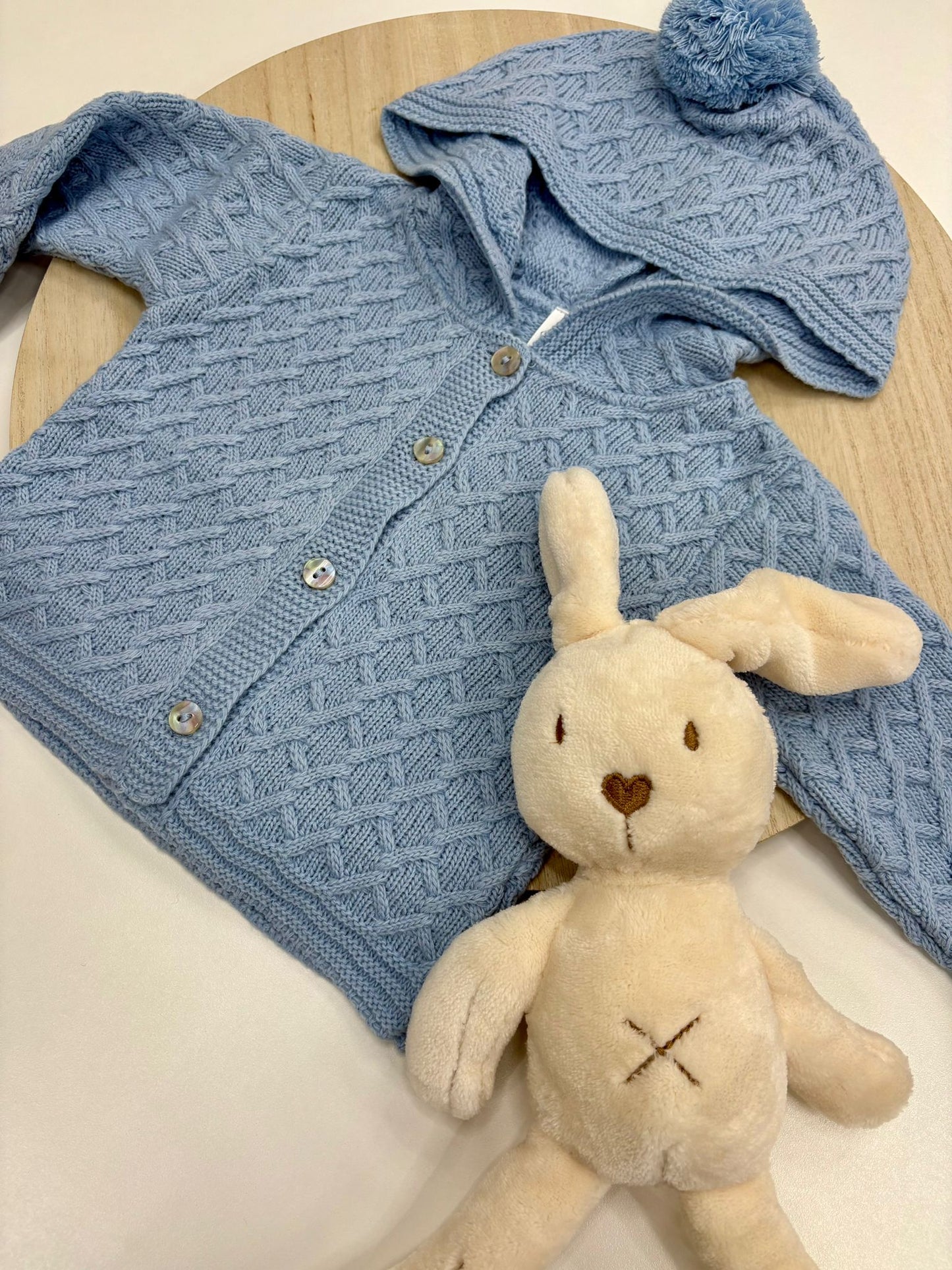 Chaqueta punto bebé con capucha y pompón color azul