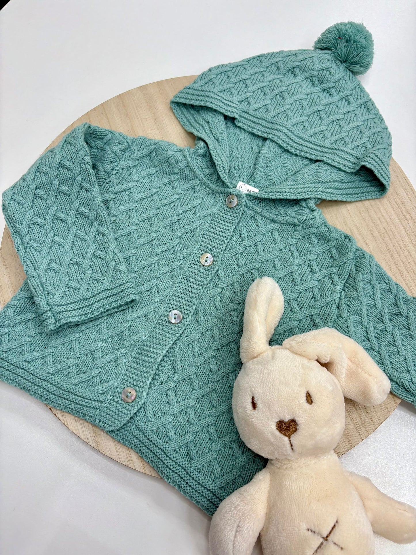 Chaqueta punto bebé con capucha y pompón color mint