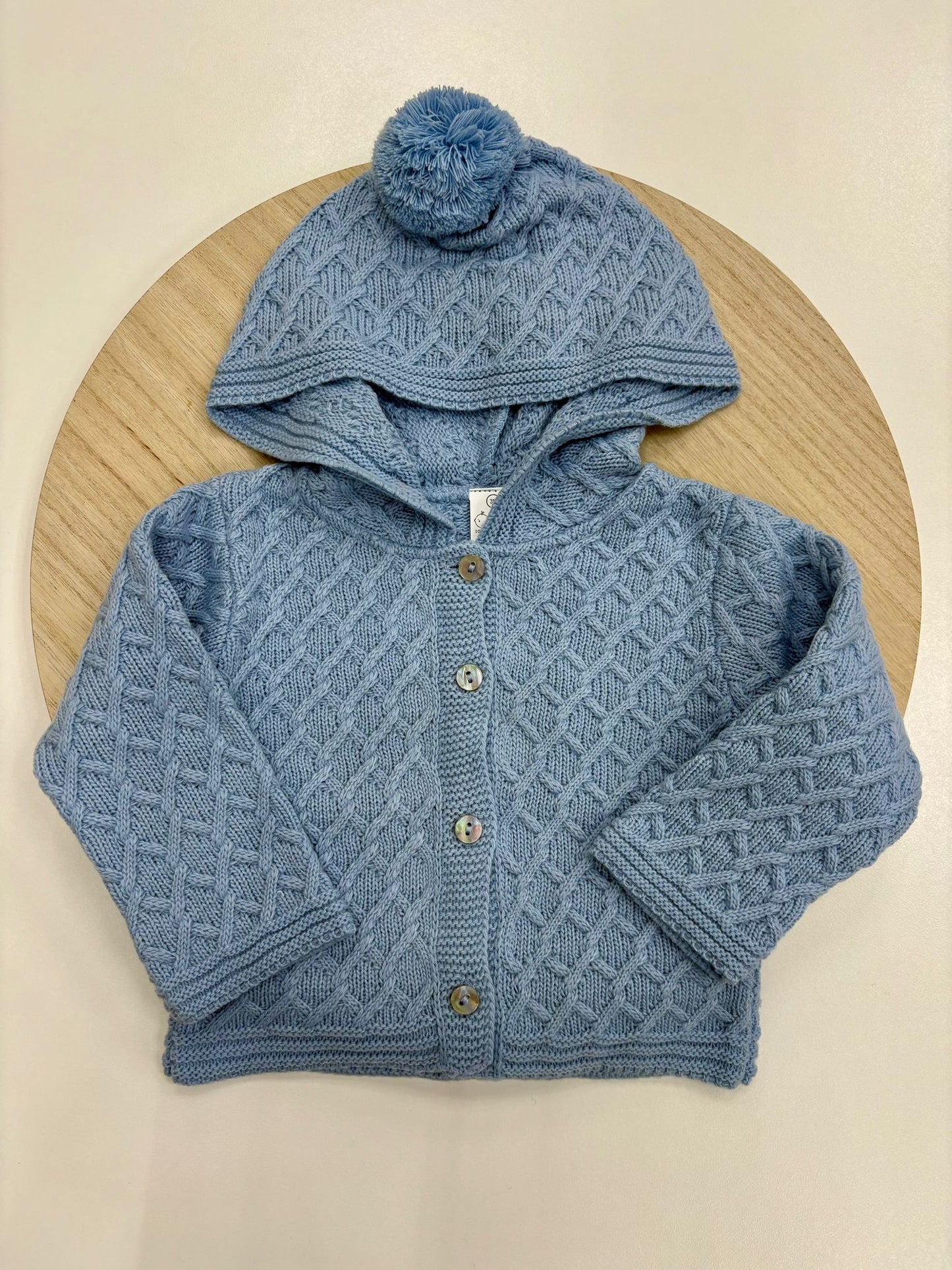 Chaqueta punto bebé con capucha y pompón color azul