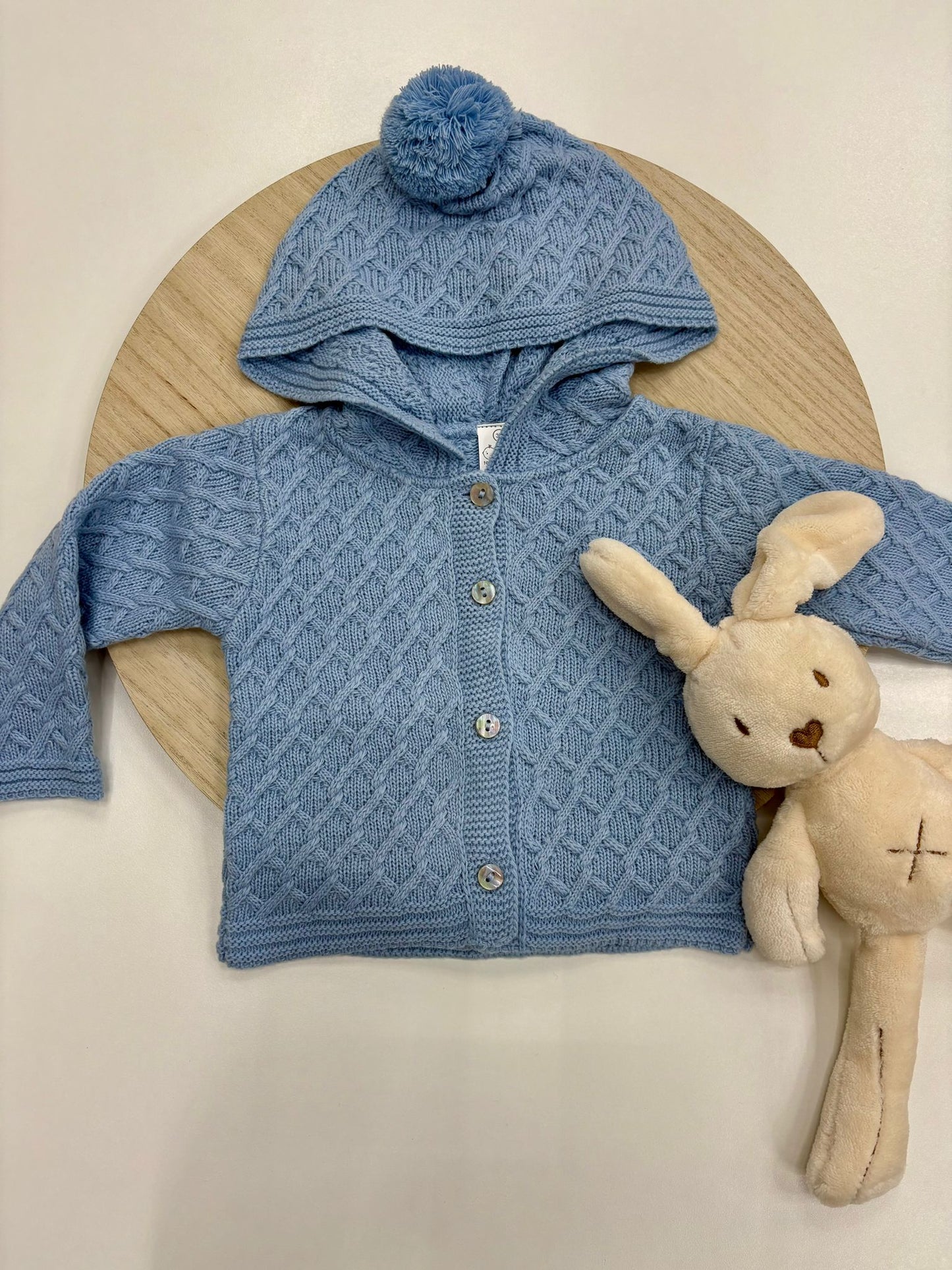 Chaqueta punto bebé con capucha y pompón color azul